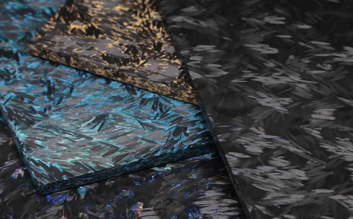 Close-up of a blue and golden colored forged carbon fiber panel texture
